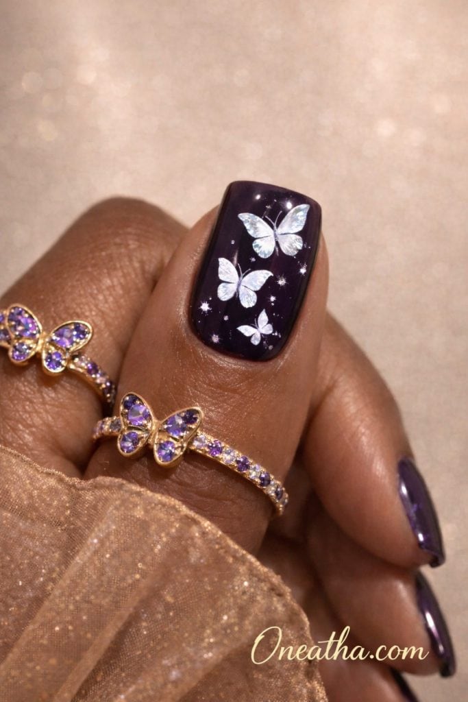 White butterfly nails feature glossy nail designs with delicate butterfly wing art that create an elegant and feminine manicure style. These designs often include rich base colors, shimmer details, and fine line work to enhance depth and dimension. White butterfly nail designs are a popular trend for classy, timeless nails perfect for everyday wear or special occasions.