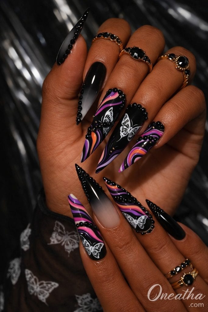 White butterfly nails feature glossy nail designs with delicate butterfly wing art that create an elegant and feminine manicure style. These designs often include bold or soft color bases, swirl patterns, gemstones, and fine line detailing for added dimension. White butterfly nail designs are a trending choice for classy, eye-catching nails that work for everyday wear, special occasions, and statement manicures.