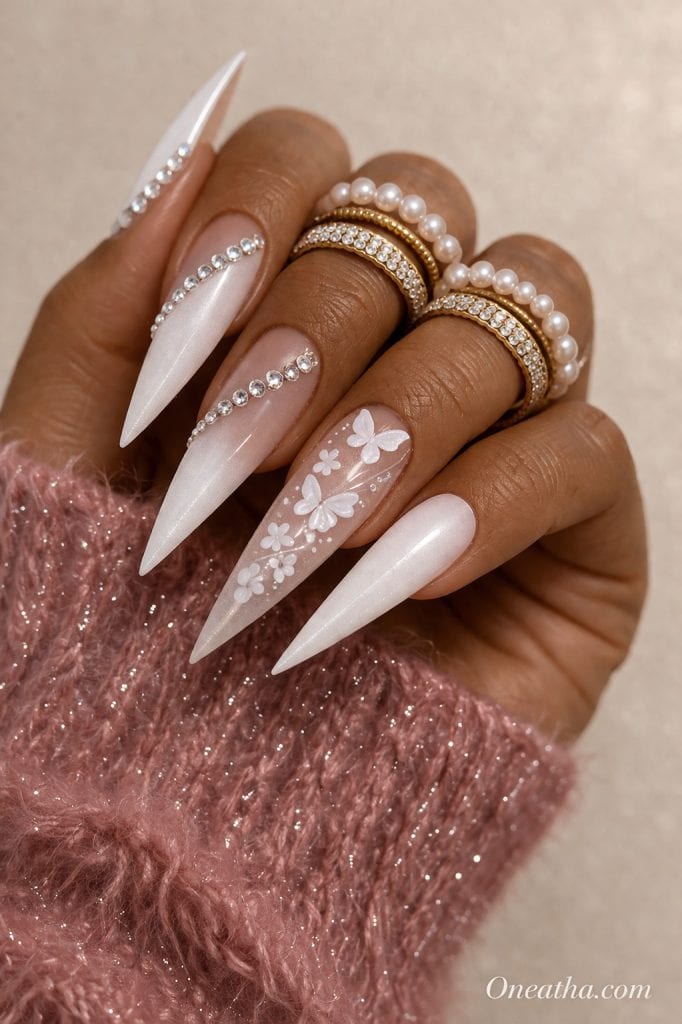 White butterfly nails with glossy finish, soft feminine nail design featuring delicate butterfly art, elegant manicure with butterflies, luxury butterfly nail inspiration, almond and stiletto butterfly nails design.