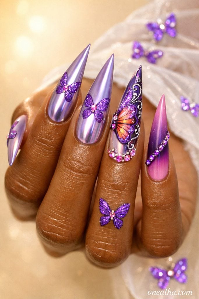 Purple butterfly nails with chrome lilac finish, ombre pink and purple nails, rhinestone accents, glossy stiletto acrylic nails, butterfly nail art design on warm-toned hand, luxury nail inspiration