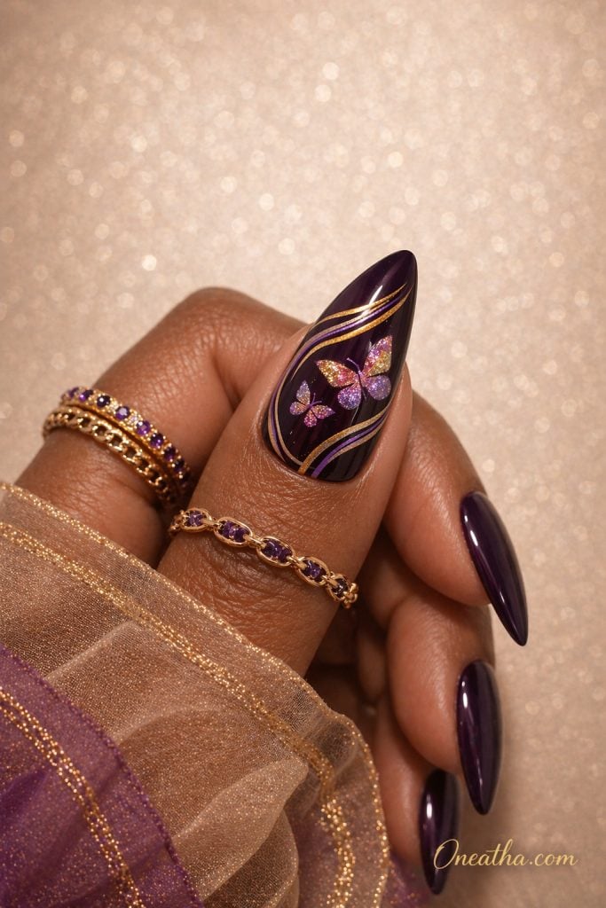 Purple butterfly nails with deep plum glossy base, gold line nail art, glitter butterfly design, almond acrylic nails, luxury dark purple nails on warm-toned hand with gold rings