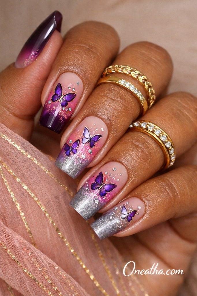 purple butterfly nails with pink to silver ombre glitter fade, square acrylic nails with glossy finish and layered butterfly nail art, soft glam purple nail design inspiration