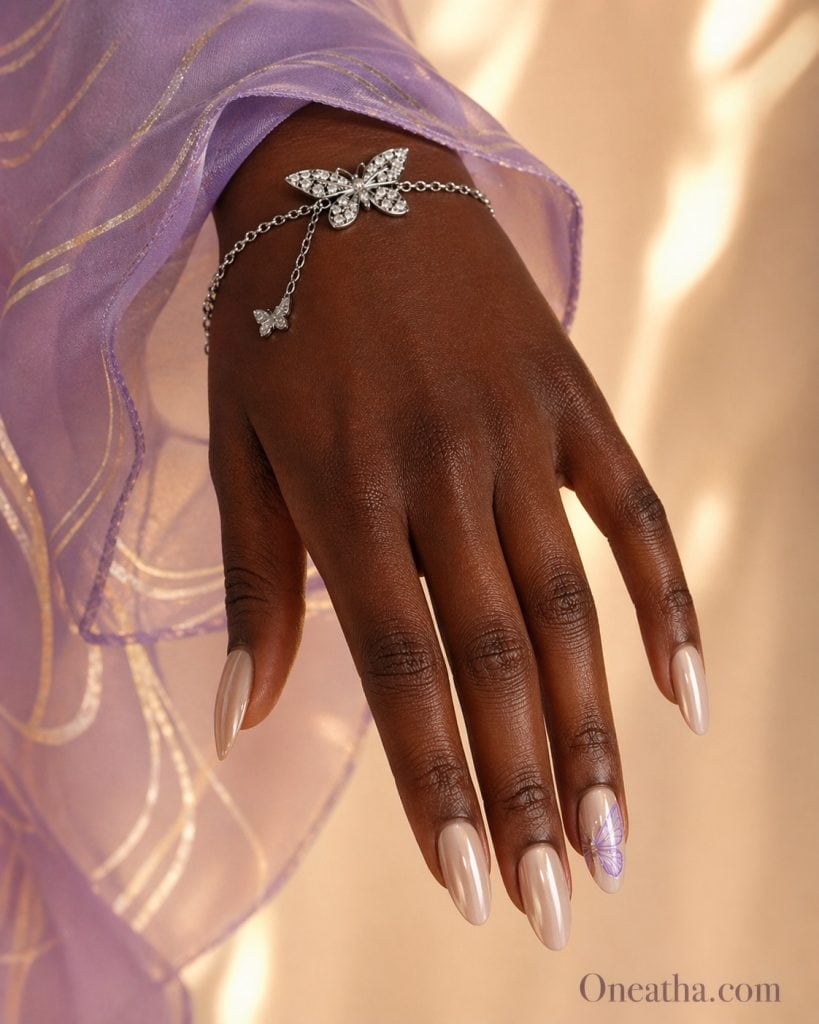 minimalist nude almond nails with purple butterfly accent, glossy sheer pink nails with delicate violet butterfly design, elegant simple purple butterfly nail inspiration