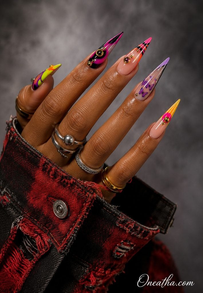 Colorful stiletto nails with subtle purple butterflies.