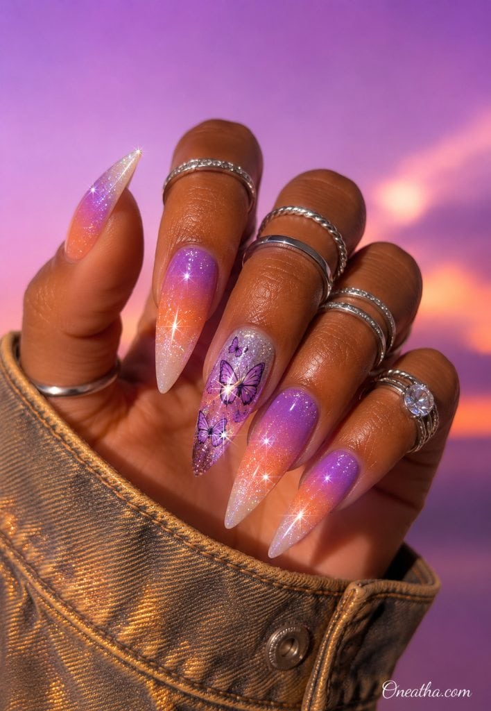 Purple sunset butterfly stiletto nails with silver rings.