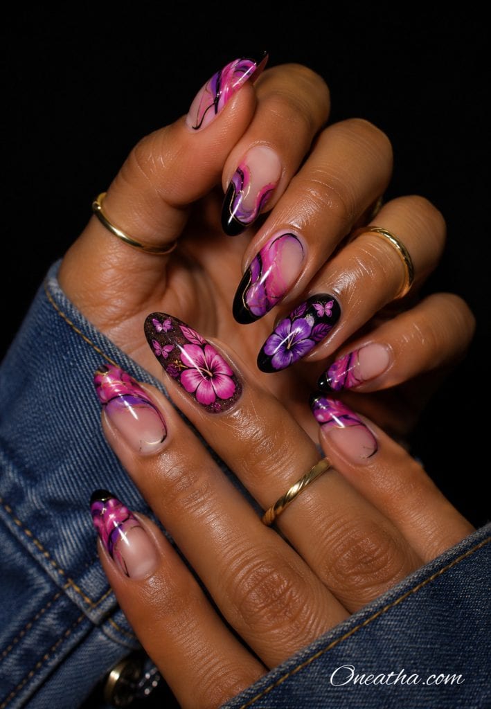 Pink and purple floral black French tip nails with butterfly accents.