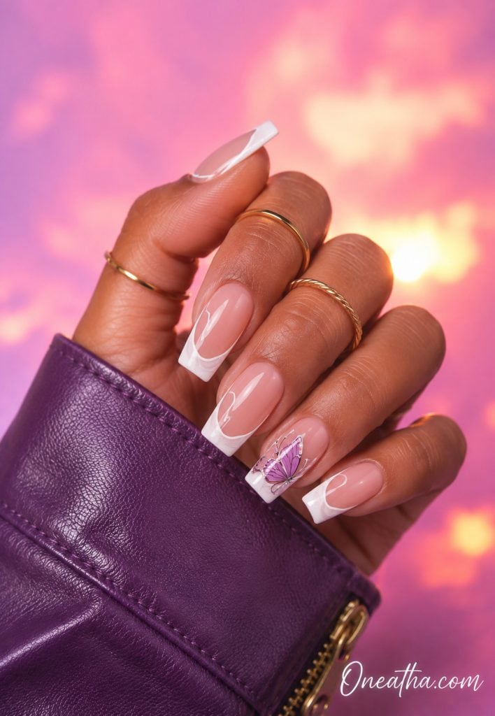 White square French tip nails with a purple butterfly accent nail.