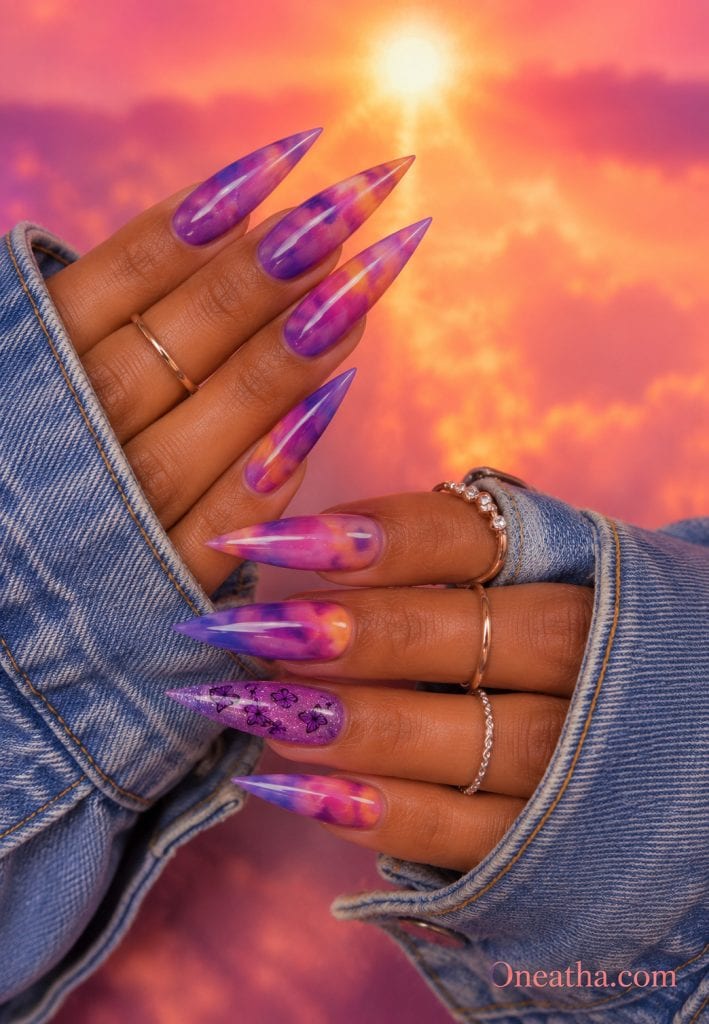 Berry tie-dye nails with a purple butterfly accent.