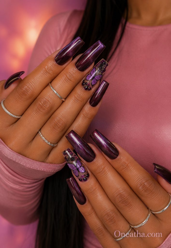 Sparkling plum coffin nails with a purple butterfly accent.