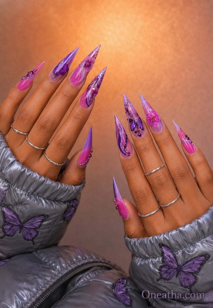 Pink and purple butterfly nails with vibrant butterfly accents.