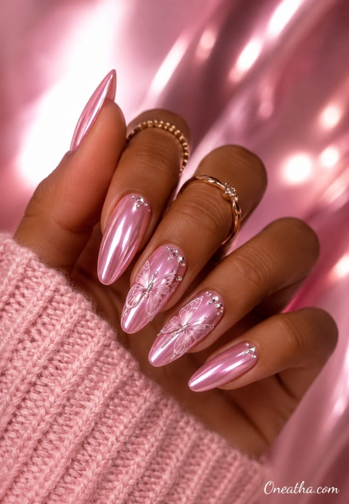 Glossy pink chrome butterfly almond nails.