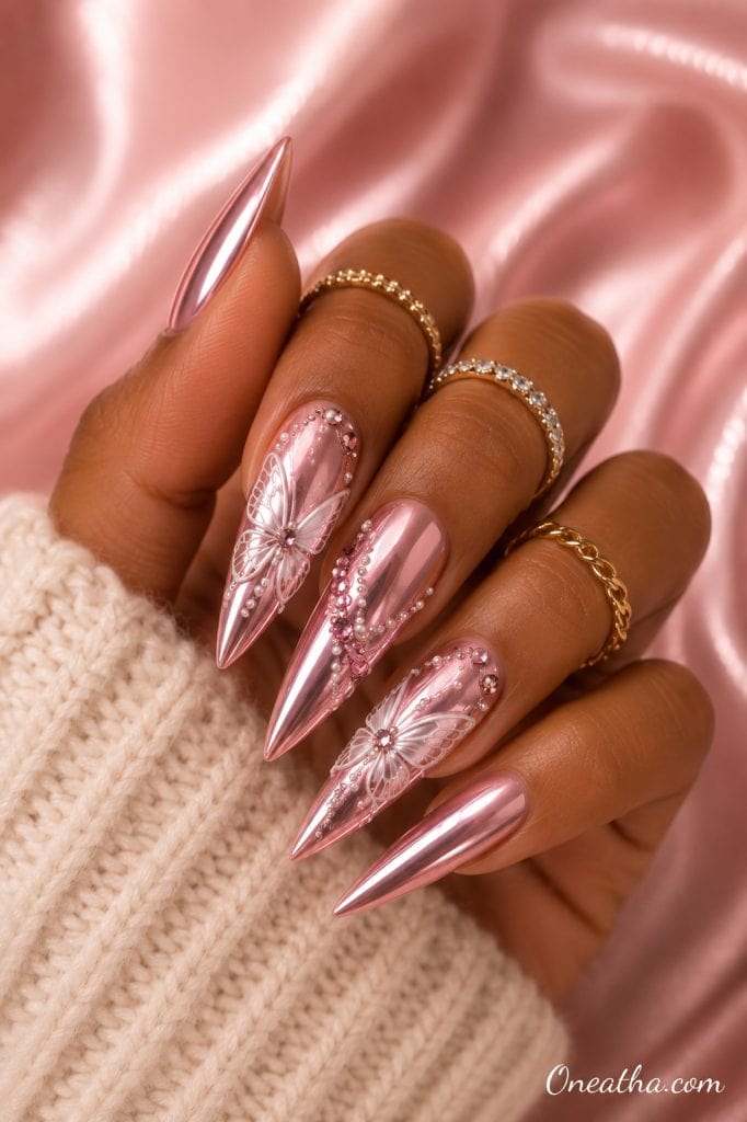 Rose chrome butterfly stiletto nails.