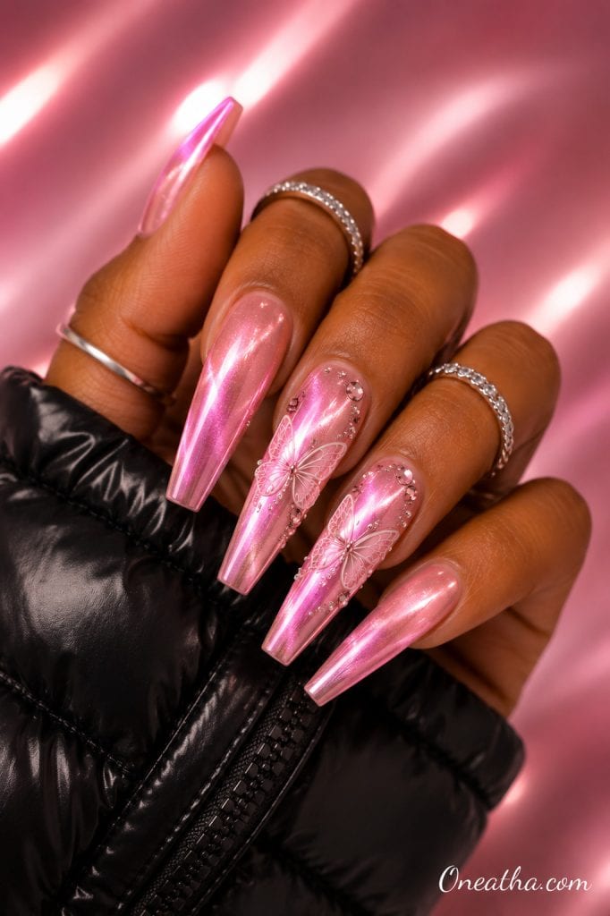 Velvet pink chrome butterfly nails.