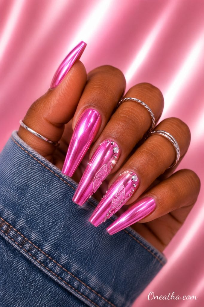 Barbie pink chrome butterfly nails.