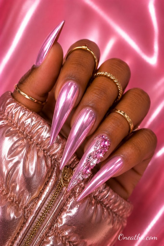 Pink butterfly gemstone nails.