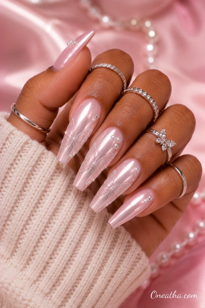 Blush chrome butterfly nails.