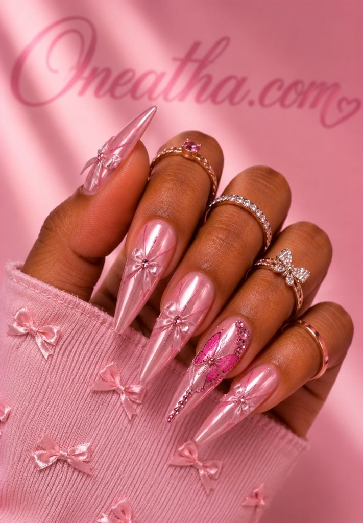 Pink bow butterfly nails.