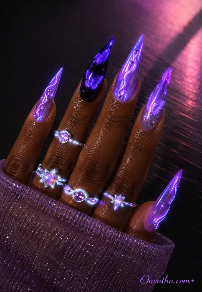 Glow-in-the-dark purple butterfly chrome stiletto nails.