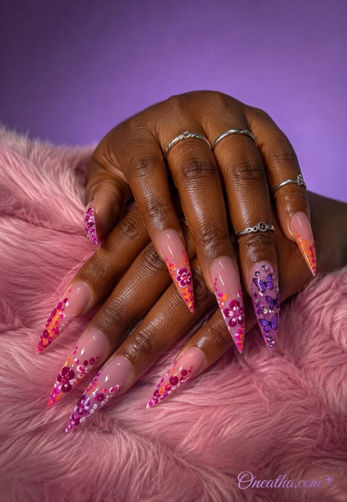 floral stiletto nails and a purple butterfly accent nail.
