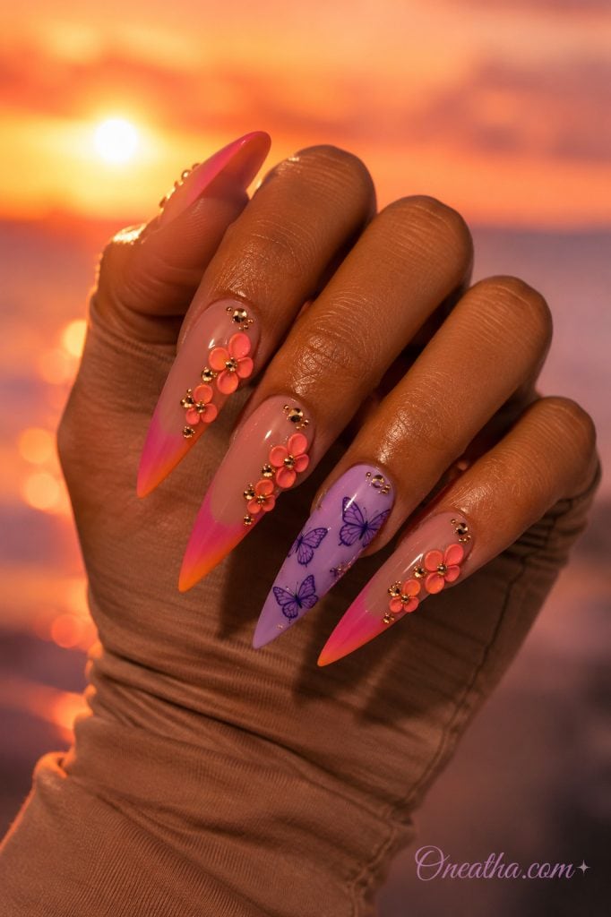 Sunset glow nails with a purple butterfly accent.