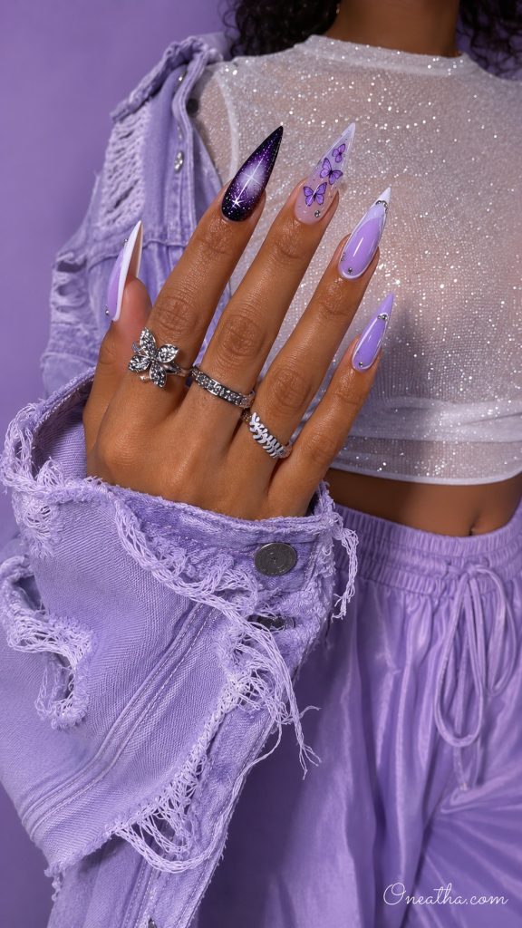 Lilac luxury nails with a black sparkle aura nail and a clear purple butterfly accent.