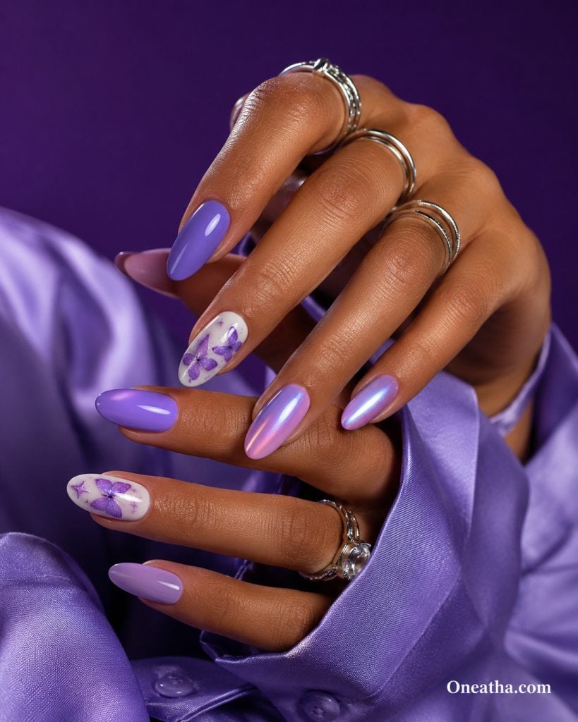 Purple butterfly nails with lavender chrome shimmer, almond-shaped aura nails, milky white accent nails, luxury nail inspiration by Oneatha, butterfly nail art, purple chrome nails, elegant manicure ideas, glossy lavender nails, Oneatha.com