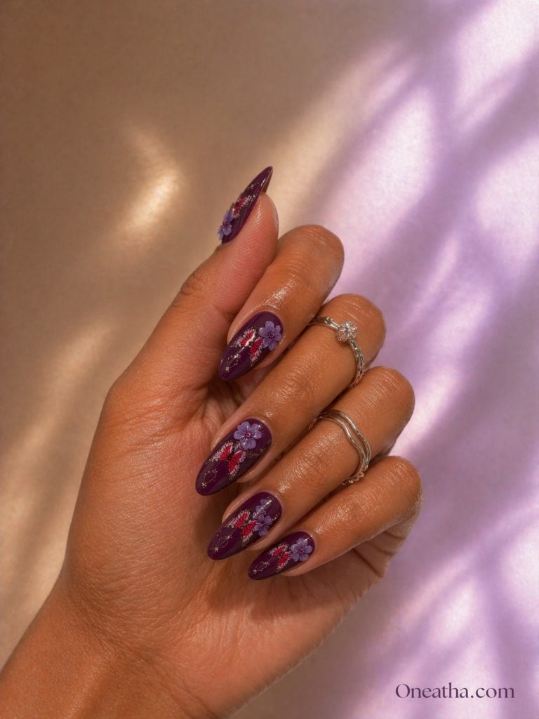 Oneatha Butterfly Sparkle purple and red floral nails featuring elegant purple flower nail art, two-tone nail design, luxury manicure inspiration, feminine spring nails, summer floral nails, glamorous nail ideas by Oneatha.
