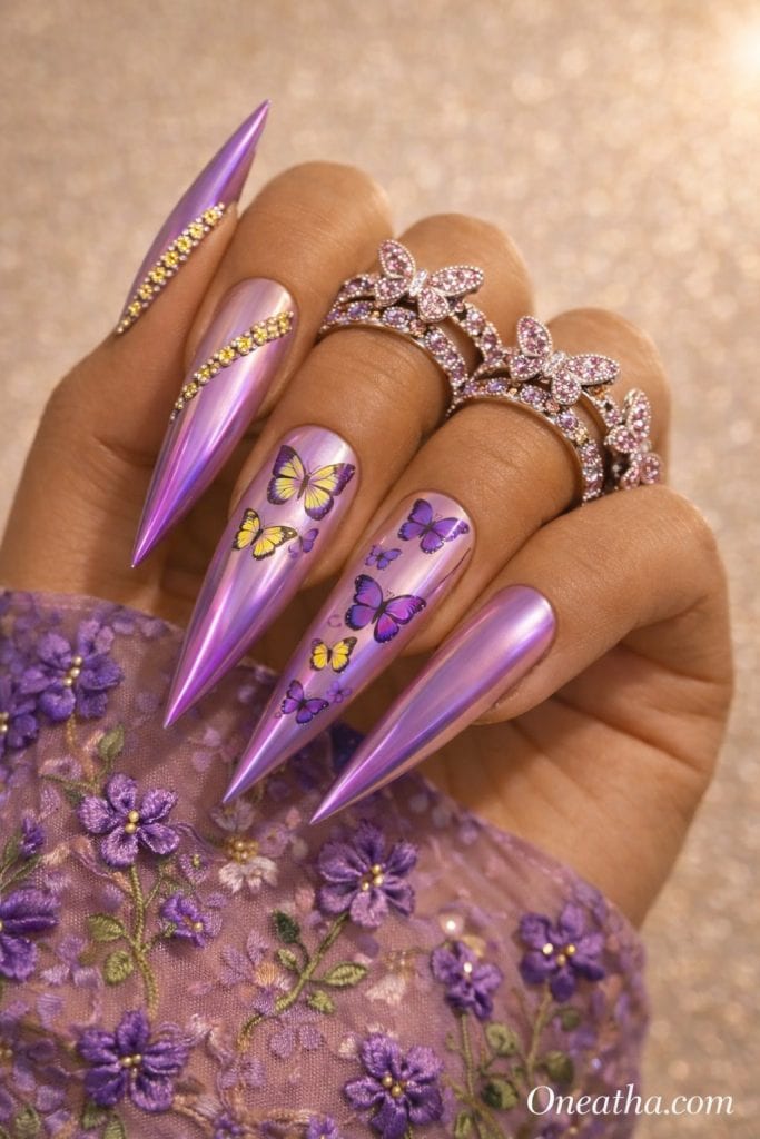 Purple Stiletto by Oneatha featuring purple butterfly stiletto nails with yellow ombré butterfly centers, spring nail inspiration, and colorful summer nail art.