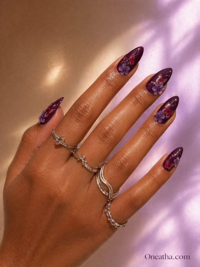 Glossy violet almond butterfly nails with elegant nail art.