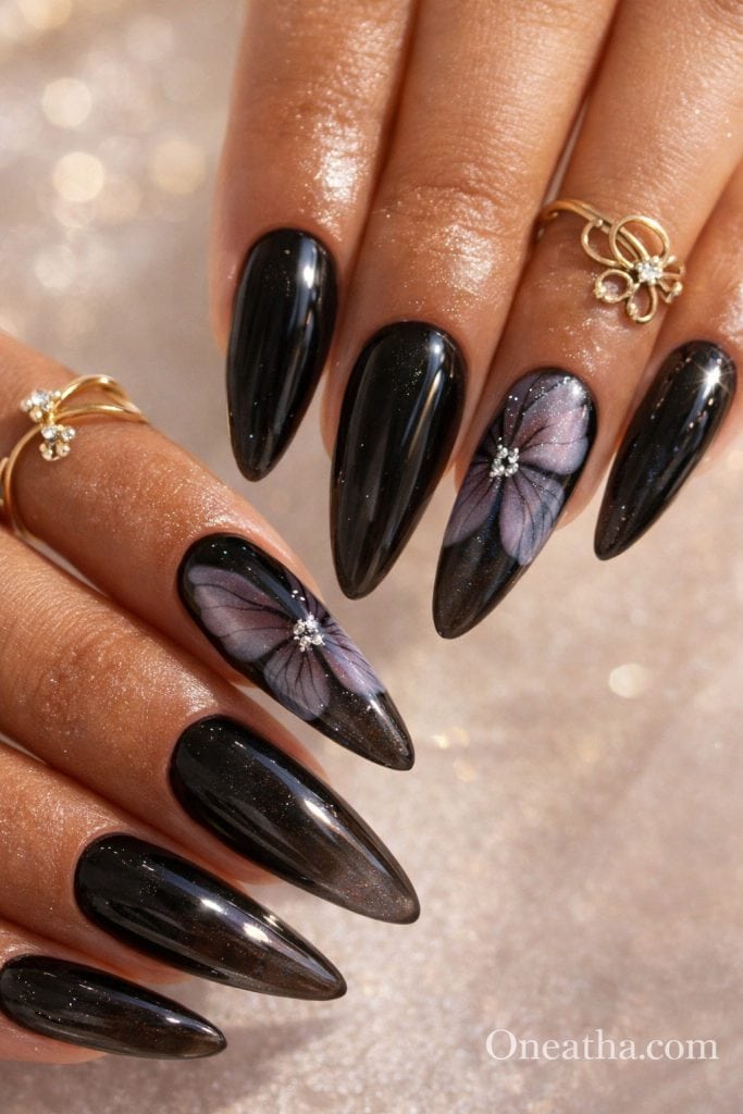 Black butterfly nails with smoky gradient effect and glossy finish on long stiletto nails. Elegant black butterfly nail design with soft shimmer detail and a luxury, high-shine look.