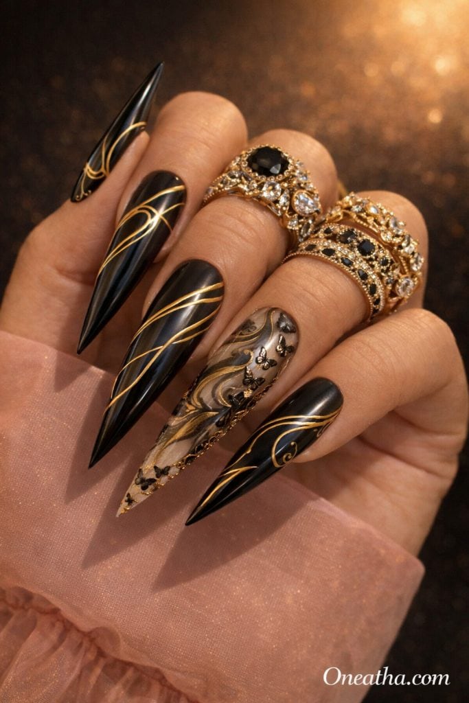 Black butterfly nails with glossy black finish, gold line detailing, and delicate butterfly accents on long stiletto nails. Elegant black butterfly nail design with a luxury aesthetic, metallic gold details, and high-shine finish.
