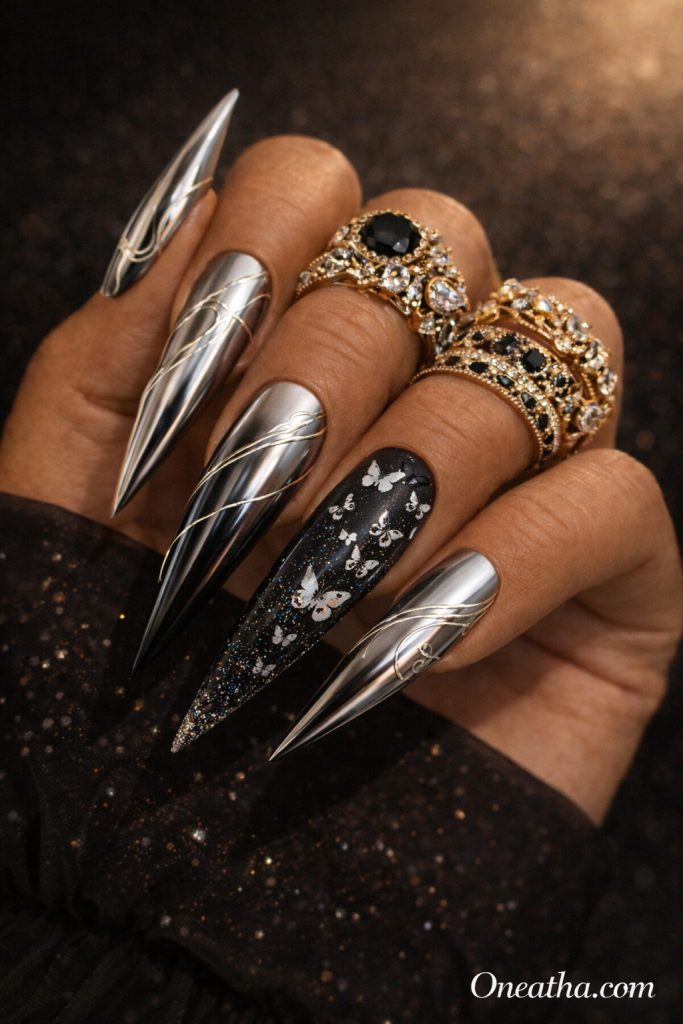Black butterfly nails with chrome metallic finish and delicate butterfly designs on long stiletto nails. Elegant black butterfly nail design with reflective shine, subtle sparkle, and a luxury high-gloss look.