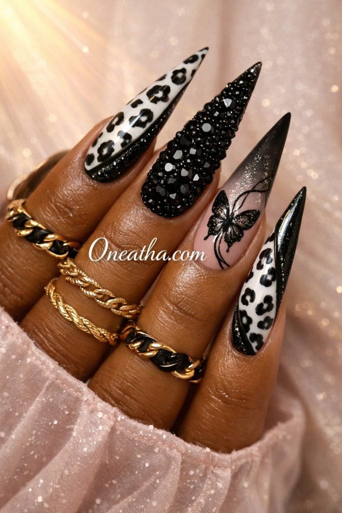 glossy black and white leopard nails with nude base bold and effortless manicure