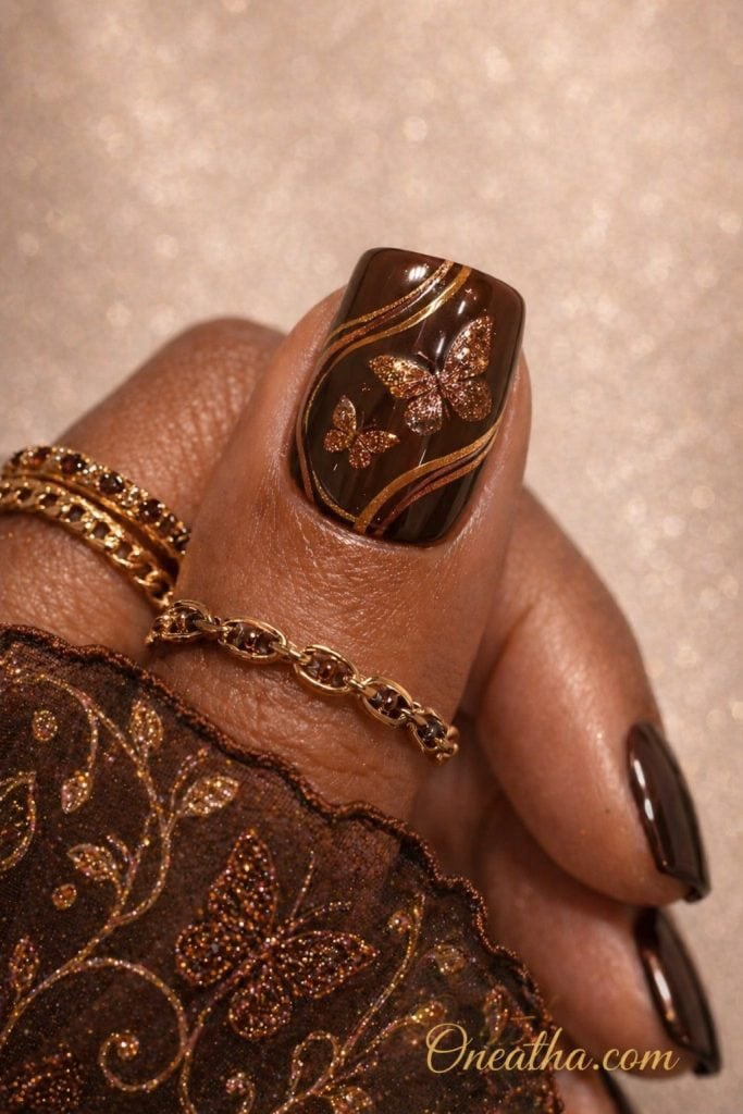 Brown butterfly nails with sparkle accents, elegant almond nail design, luxury butterfly nail art, soft brown manicure inspo for all seasons, trendy aesthetic nail design for salon or DIY.