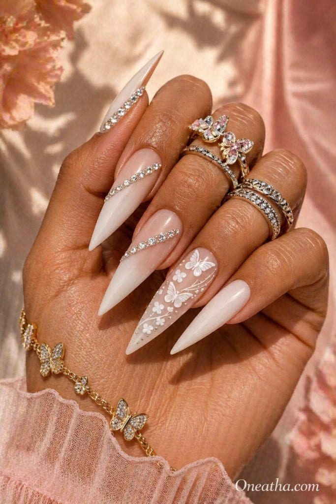 Butterfly nail designs featuring cute summer butterfly nails with an accent nail covered in scattered butterfly details, soft dreamy styling, and an elegant seasonal nail aesthetic.