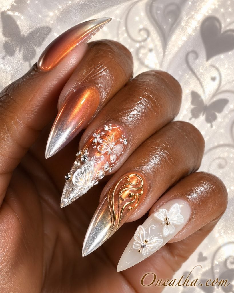 Butterfly nail designs featuring orange ombré nails with silver chrome tips, elegant seasonal nail art with butterfly accents and a bold modern summer nail aesthetic.