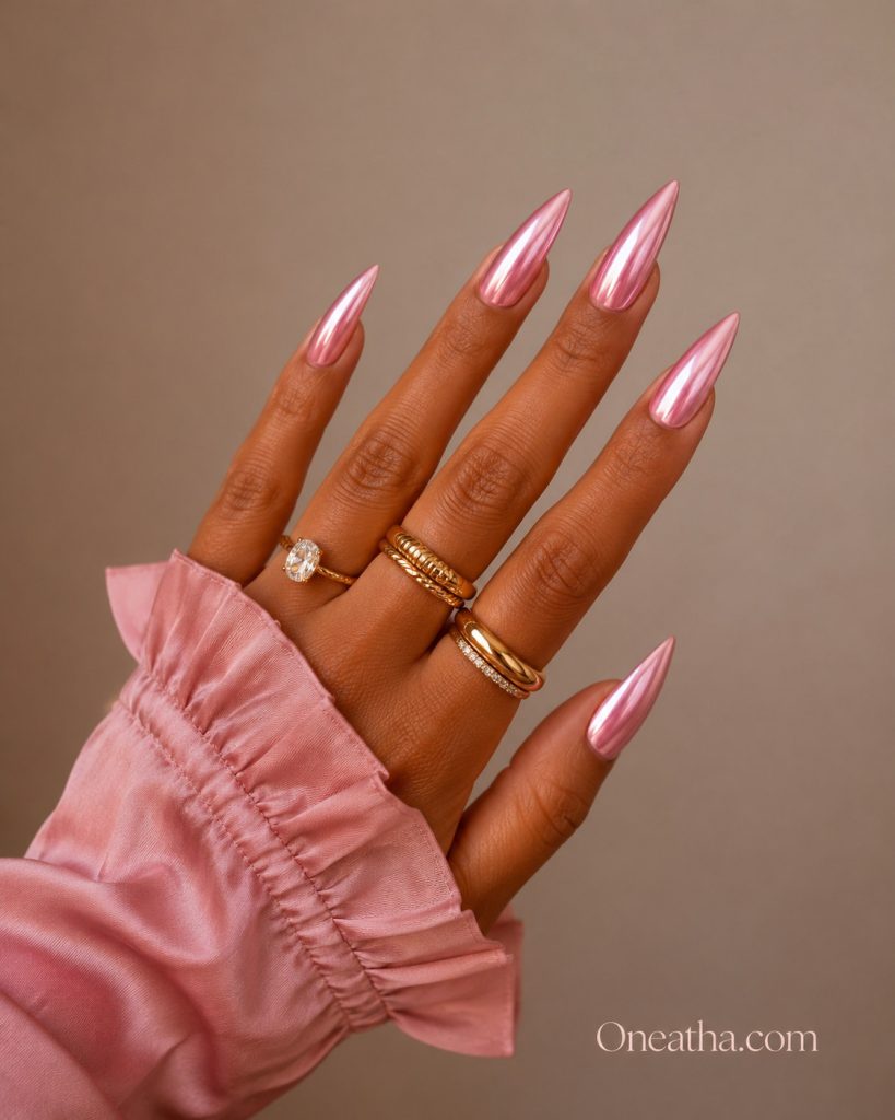 Pink chrome nails by Oneatha featuring a glossy pink chrome finish with a reflective shine, creating a chic and elegant summer nail look.