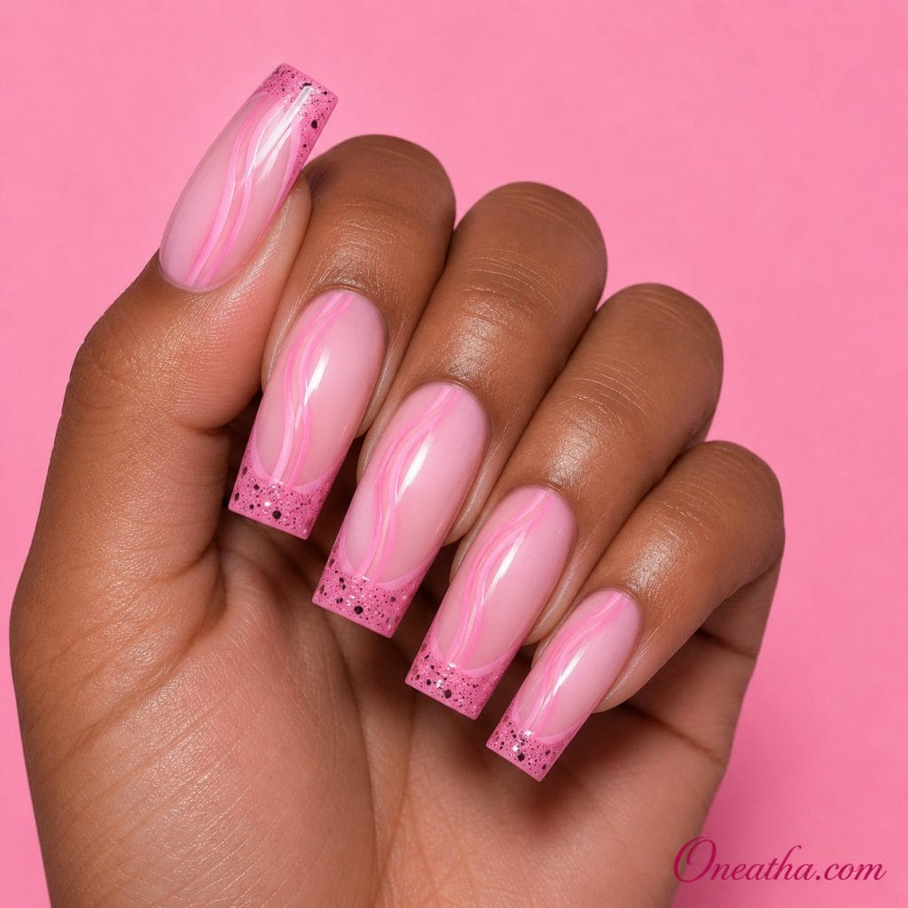 Pink acrylic nails by Oneatha featuring glittery pink acrylic tips, soft pink tones, and a glamorous feminine design perfect for birthdays, girls' nights out, and special occasions.