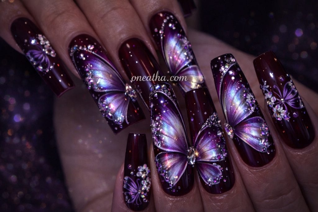 Purple Butterfly by Oneatha featuring purple butterfly nail design, rich purple nail art, elegant butterfly manicure, and versatile luxury nail inspiration.