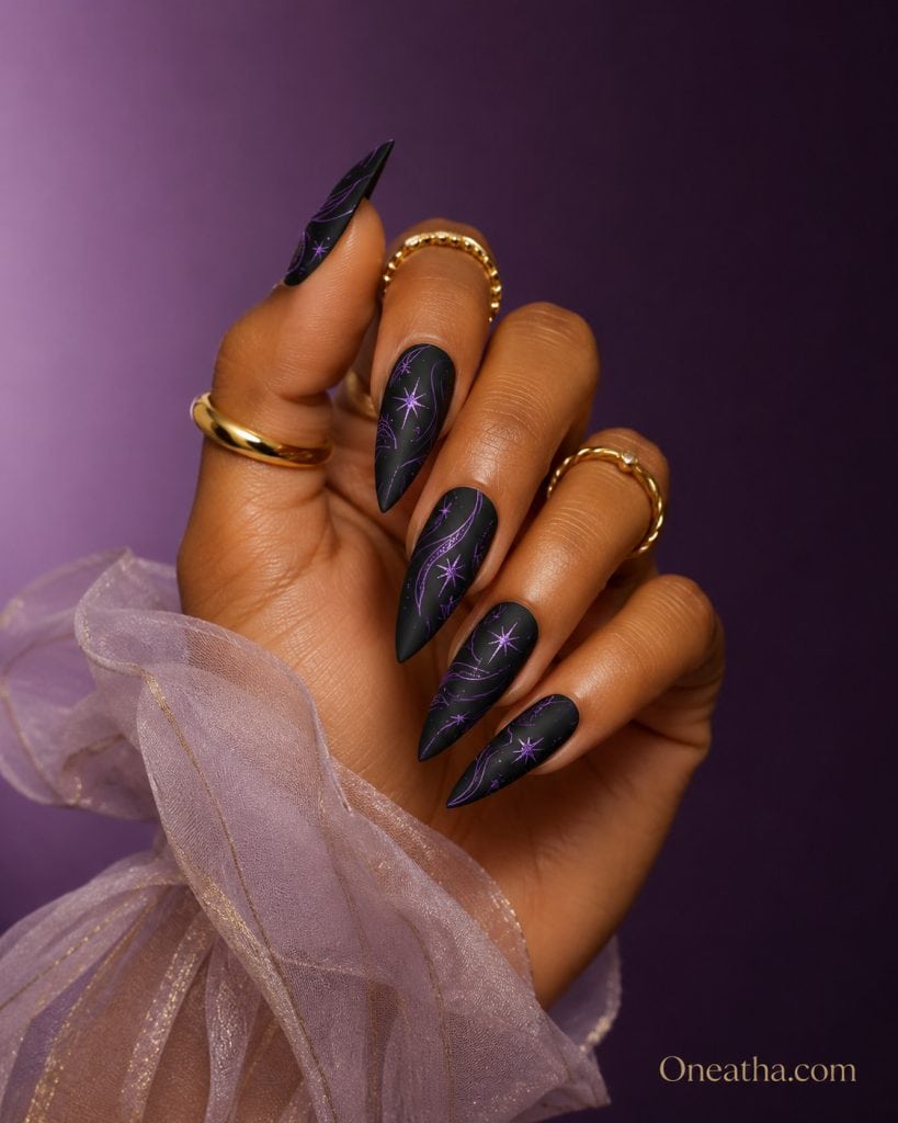 Oneatha Matte Luxe Nails featuring black matte stiletto nails with purple line art and violet sparkle fireworks design, luxury nail art by Oneatha.