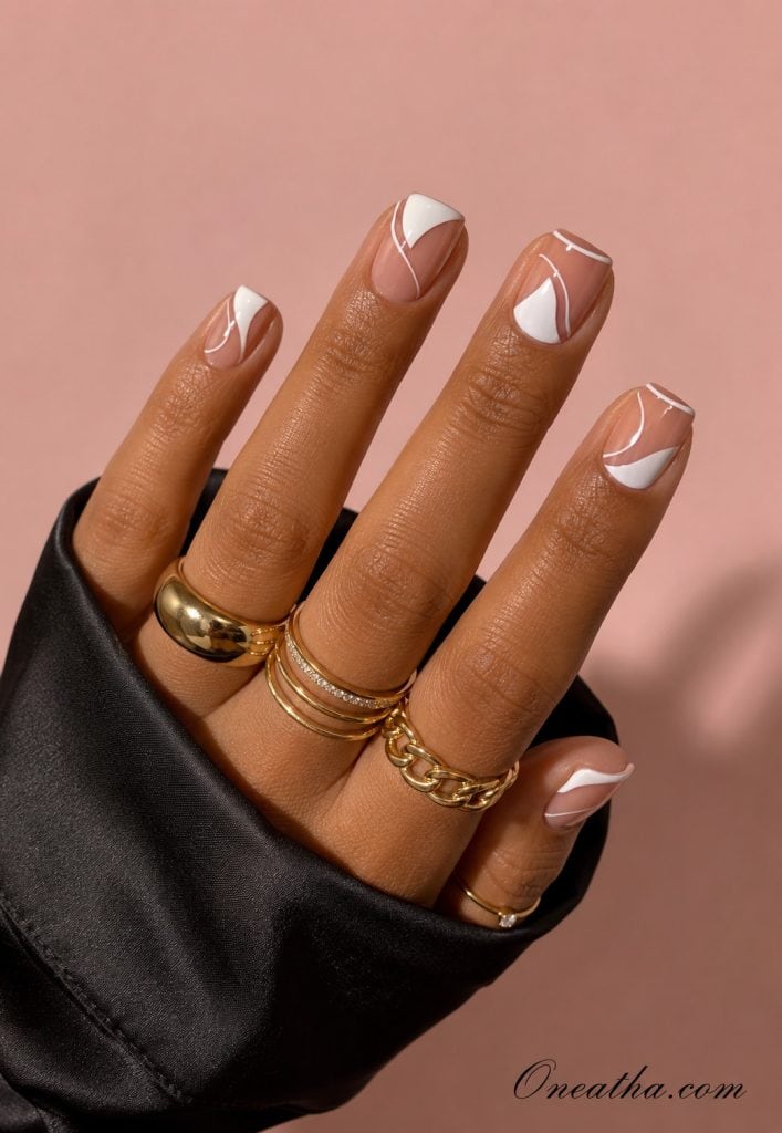 Chic sleek French tip nails with glossy finish and crisp white tips, elegant feminine nail design by Oneatha.