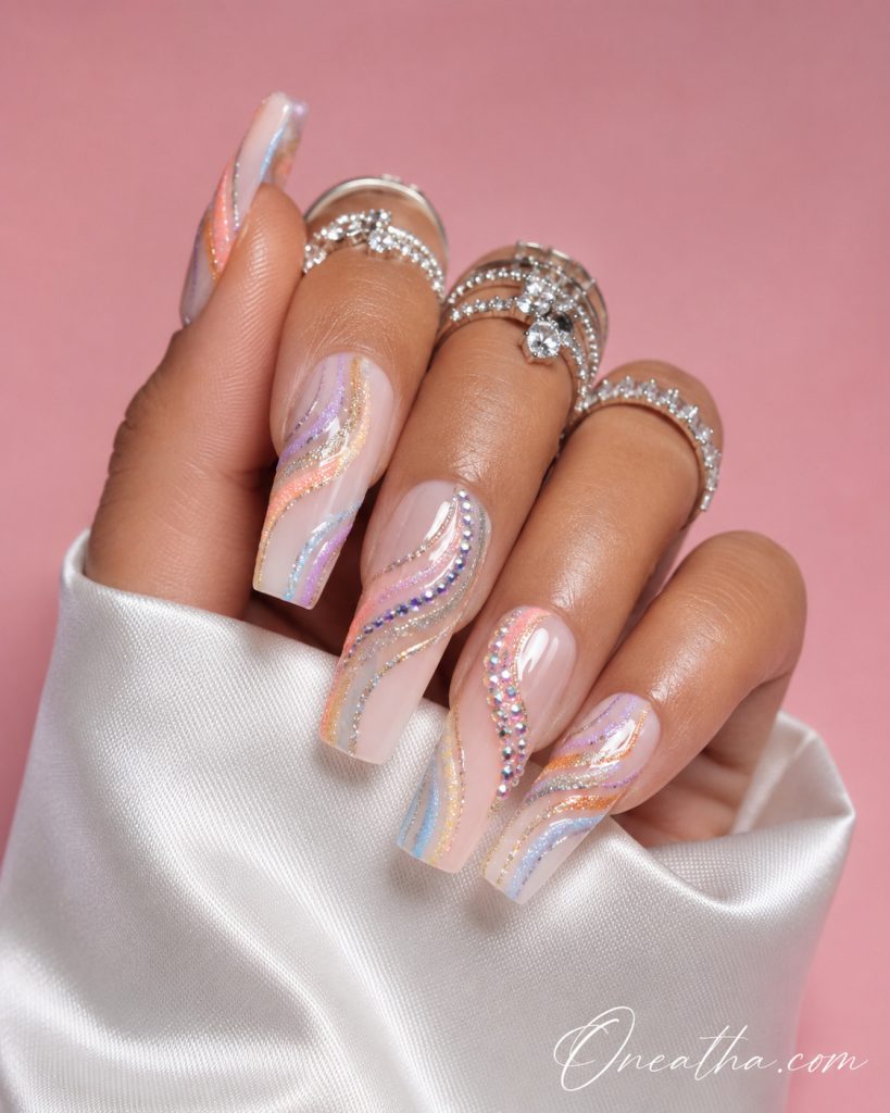Colorful rainbow nail designs with vibrant blended tones, bold baddie nails by Oneatha.