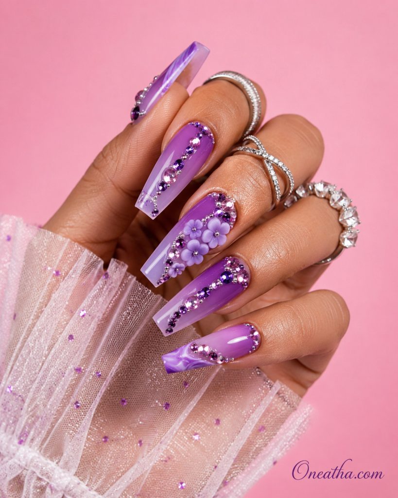 Luxe purple floral nail design with elegant flower accents, feminine baddie nails by Oneatha.