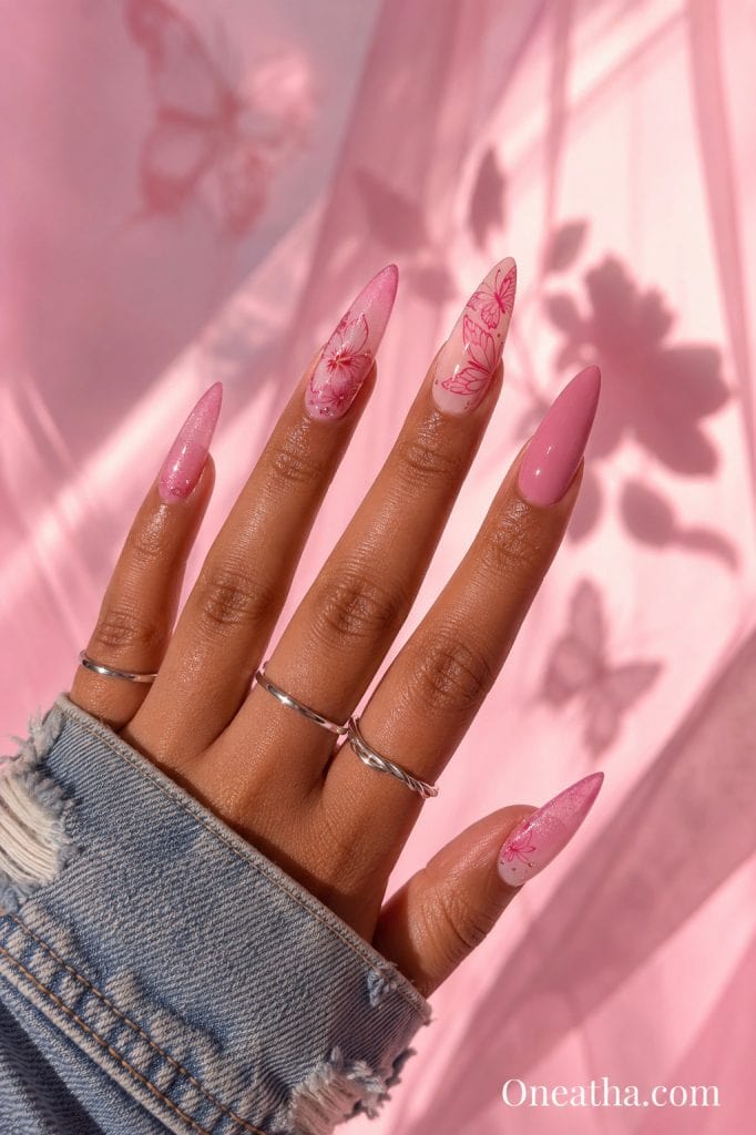 Pink botanical butterfly nails with glossy accent nail.