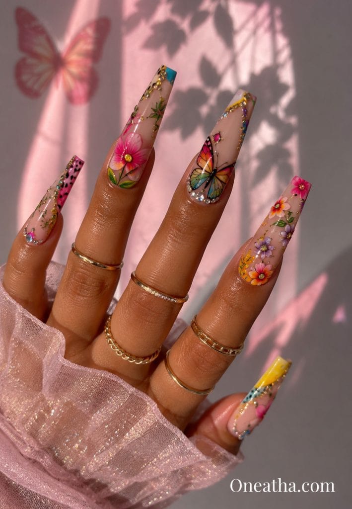 Multicolored floral butterfly coffin nails.