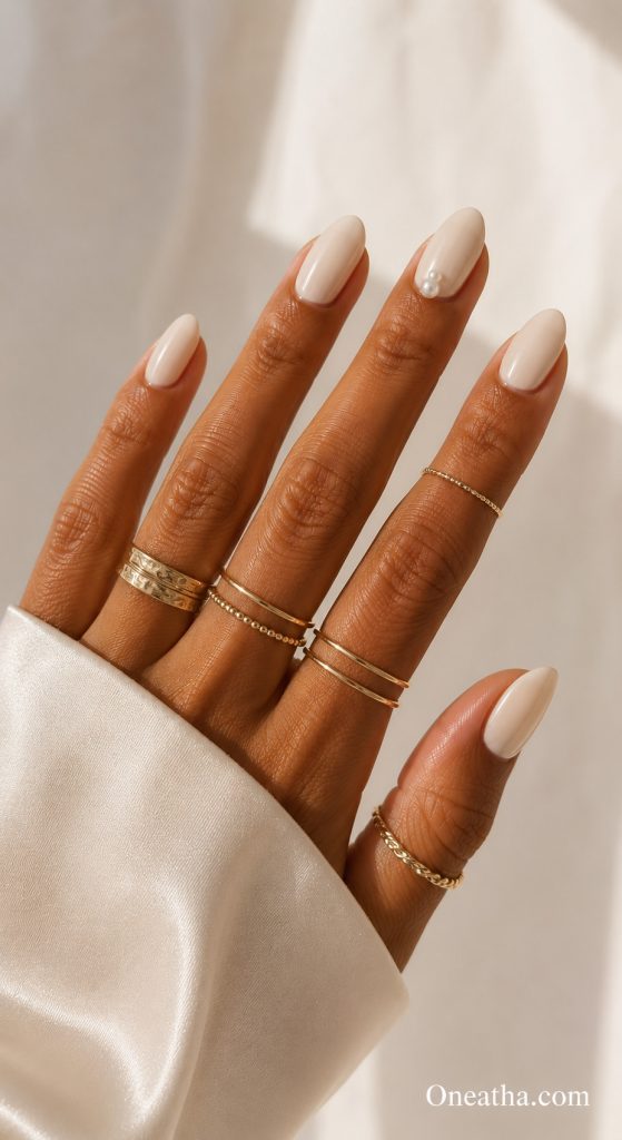 Pearl accent nails by Oneatha