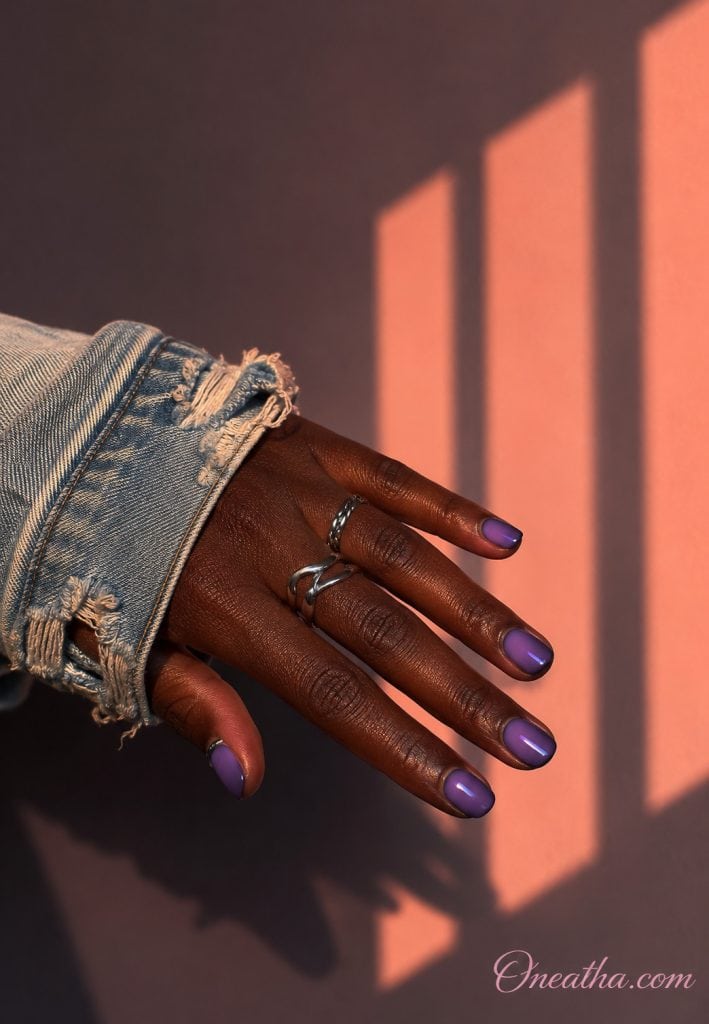 Short glossy violet nails by Oneatha.