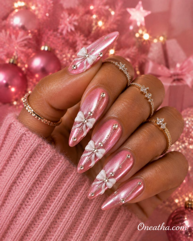 Pink velvet Christmas bow nails by Oneatha.