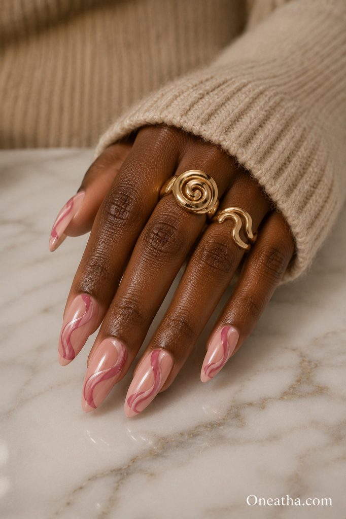 Pink abstract swirl nail art.