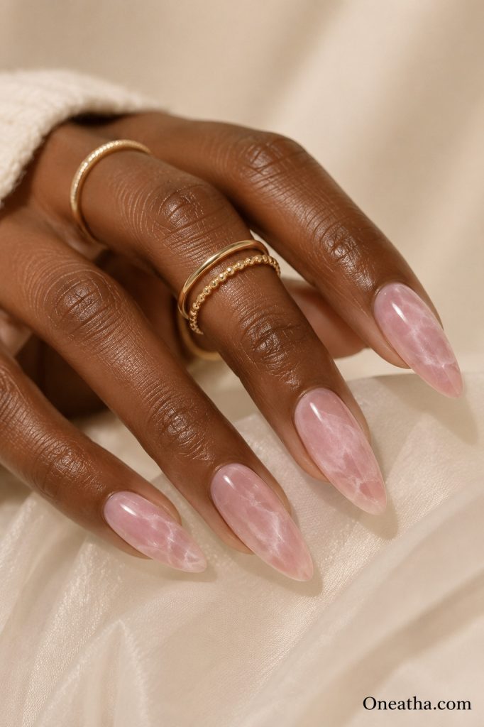 Rose quartz marble pink almond nails.